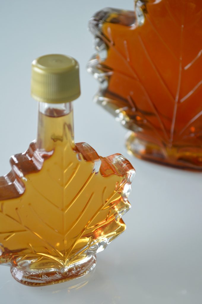 Pure maple syrup in two clear glass leaf shaped bottles. 

Maple and bourbon combo is delicious for pork jerky recipes. 